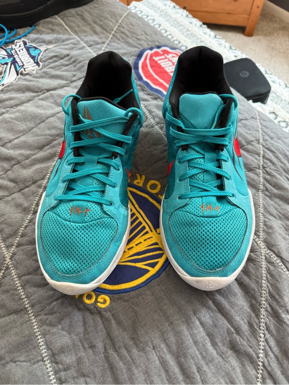 Nike Teal Athletic Shoes with Red Swoosh